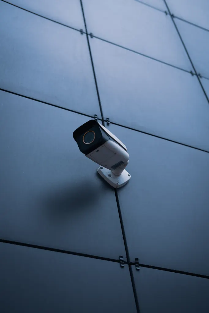 Security camera mounted on a dark architectural facade