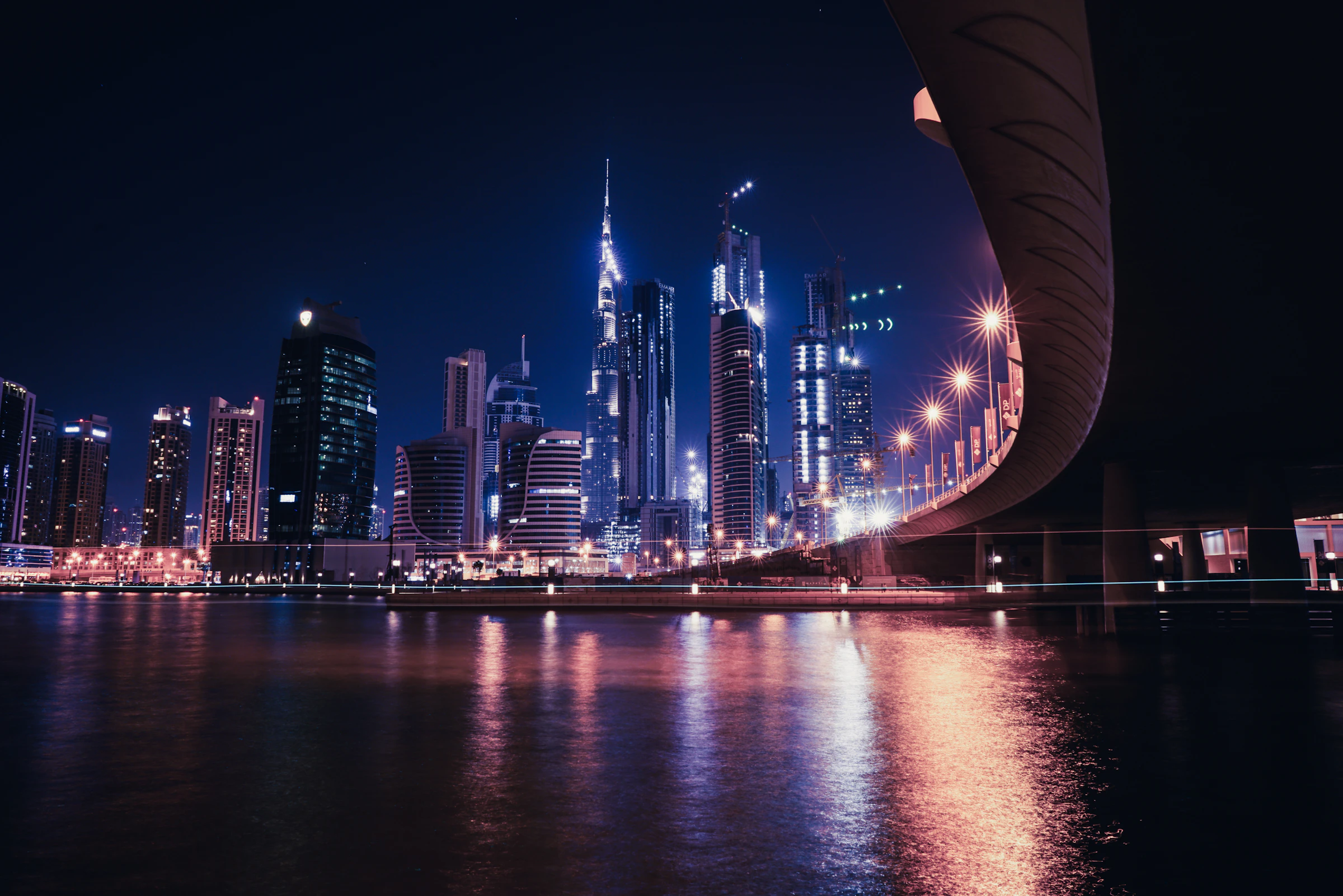 Dubai skyline and waterfront illuminated at night