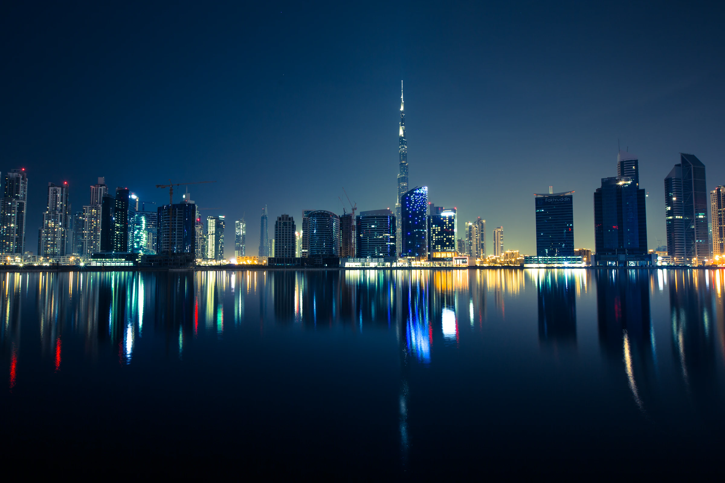 Dubai skyline and waterfront at night