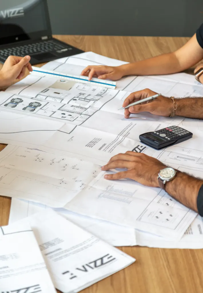 Engineer reviewing technical drawings