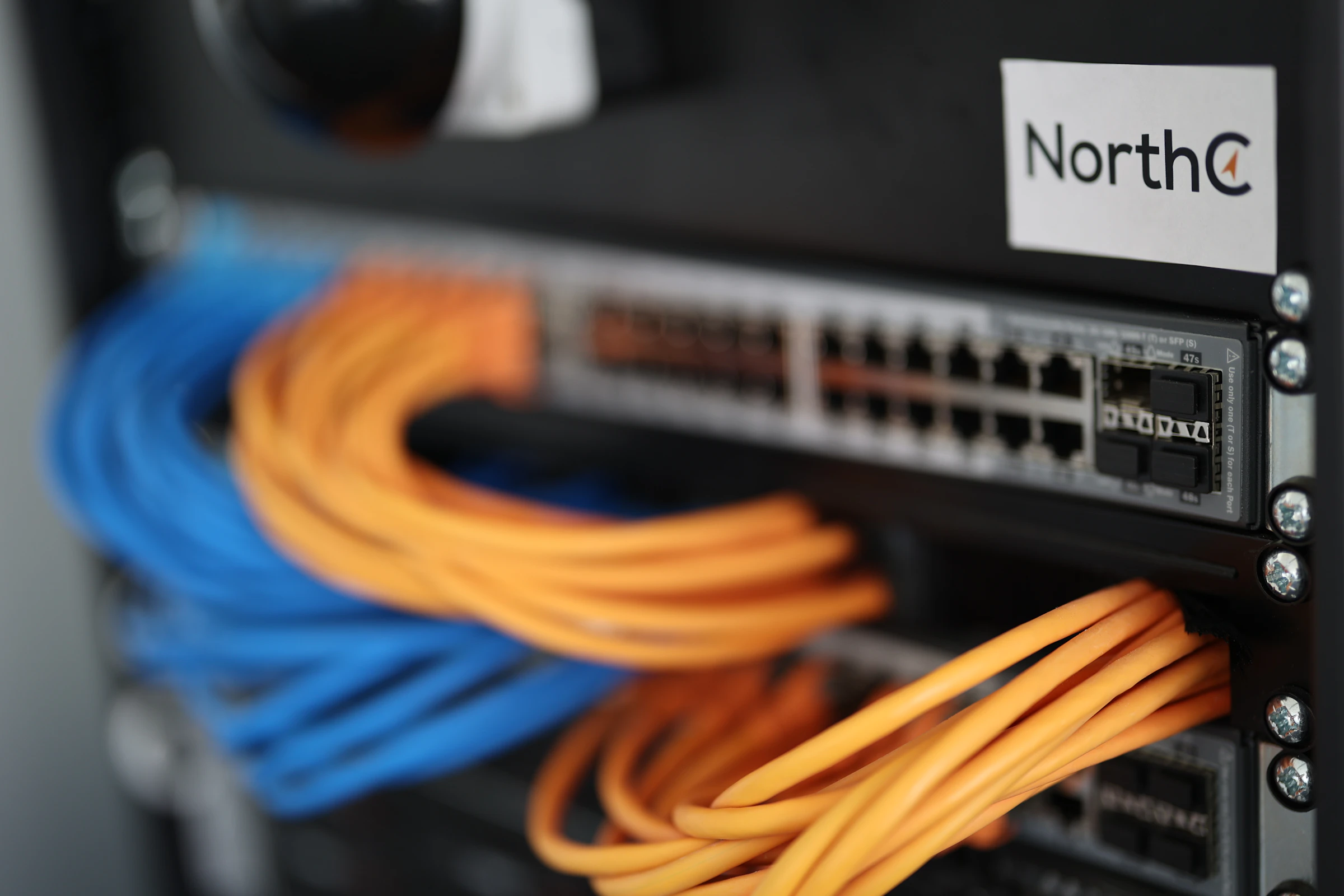 Network switch with patch cables in a rack