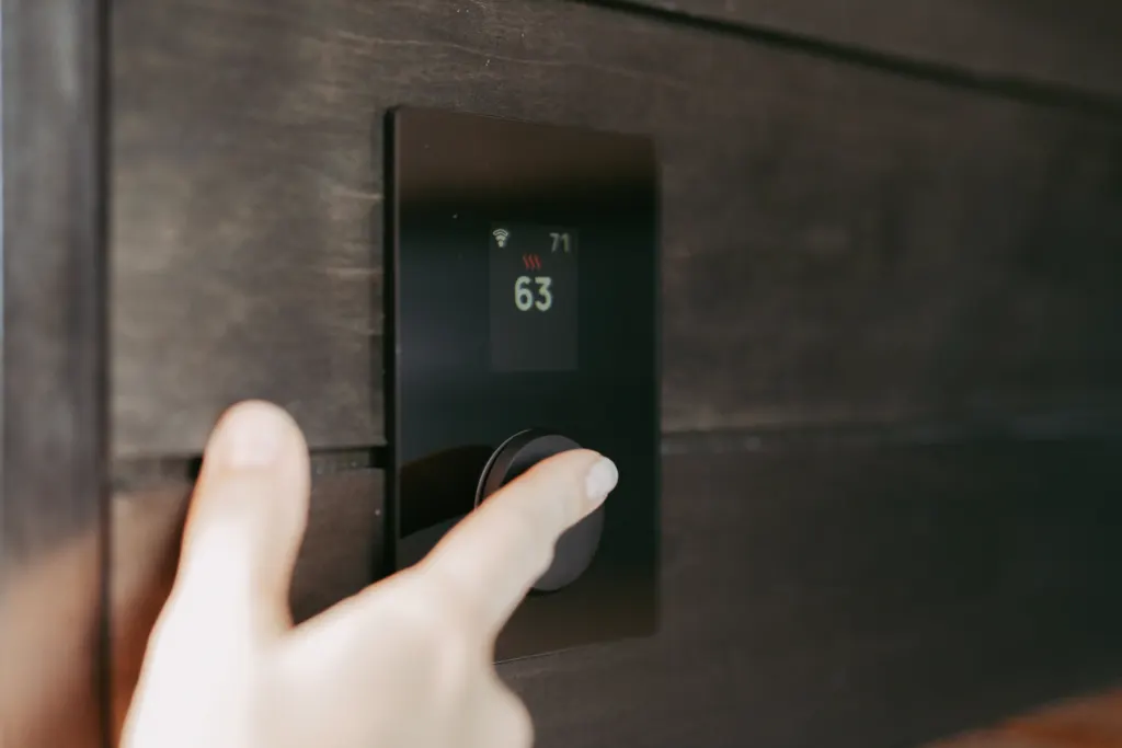 Minimal wall-mounted control panel on a dark wall